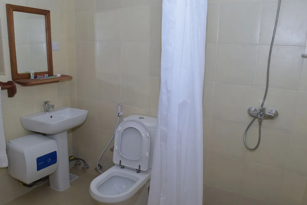 Chukwani Executive Inn - Chambres