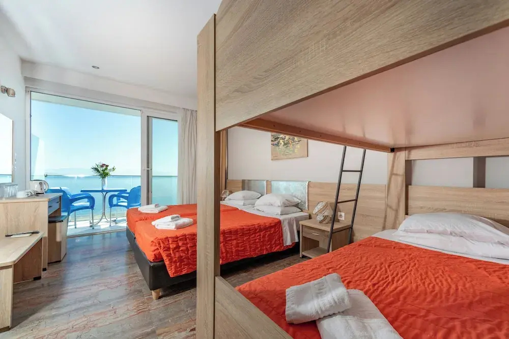 Standard Quadruple Family room with balcony and with sea view