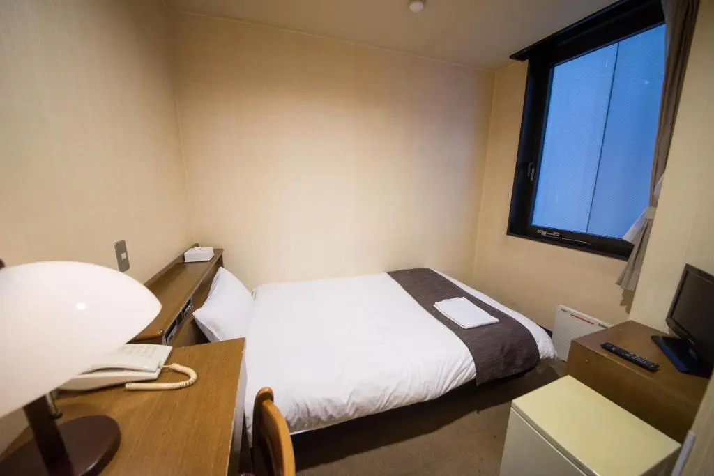 Sai Hotel - Chambres