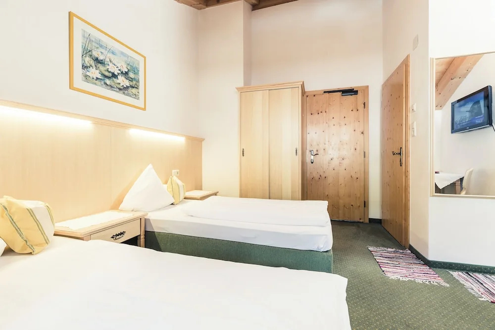 Andre Arnold - Boutique Pension - Chambres