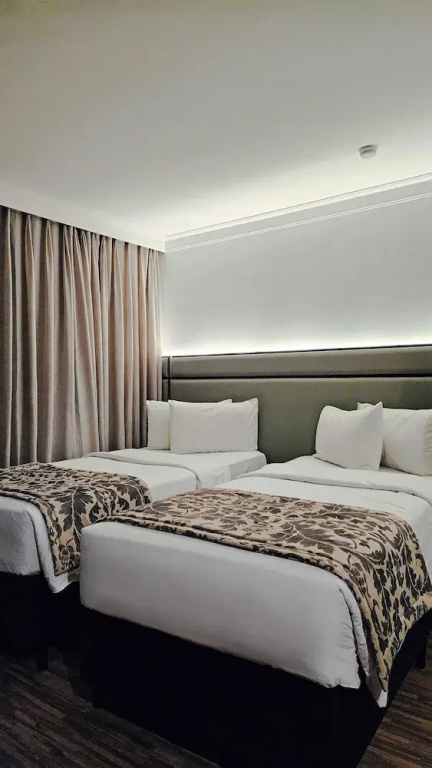 Transamerica Prime International Plaza - Chambres