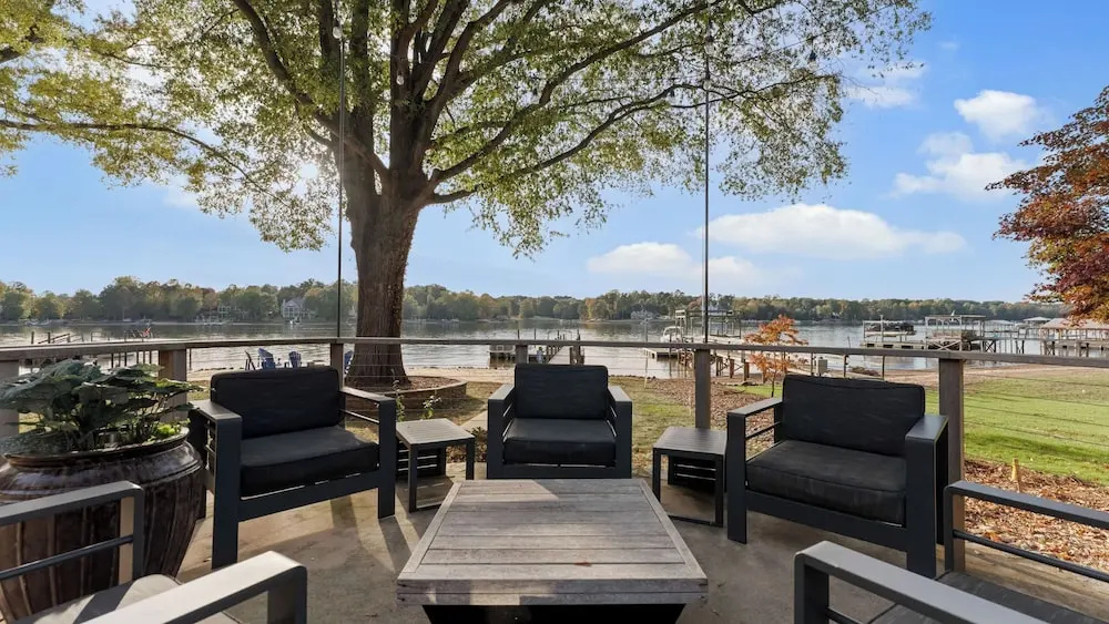 Lake Norman Lakefront w/ Private Beach, Dock, Hot Tub & Fire Pit Sandy Shore by Avantstay