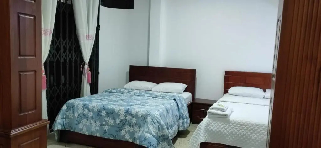 Standard Quadruple room with garden view