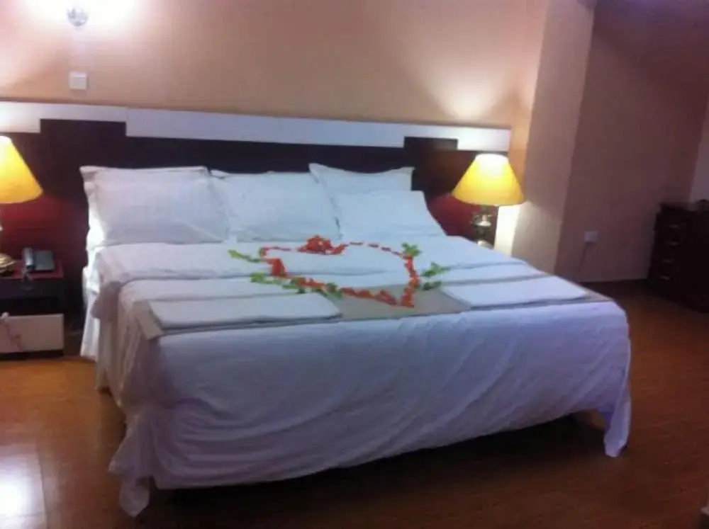 The Coconut Grill Hotel - Chambres