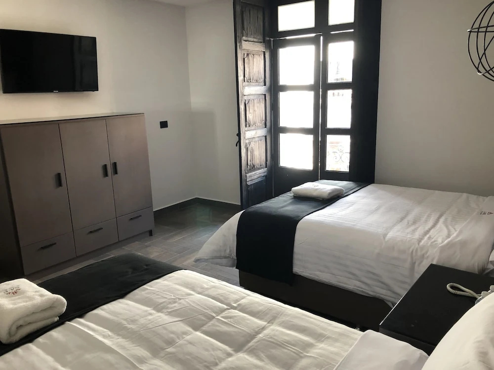Standard Quadruple room with courtyard view