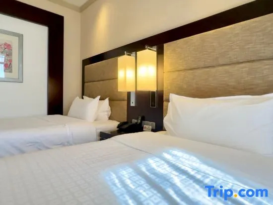 NCEC Jinyuan Hotel - Chambres