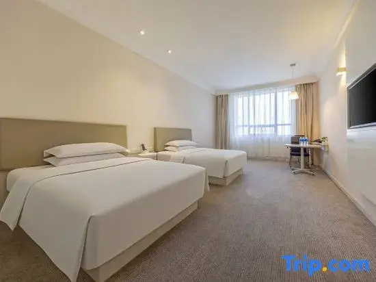 Tian Long Hotel - Chambres