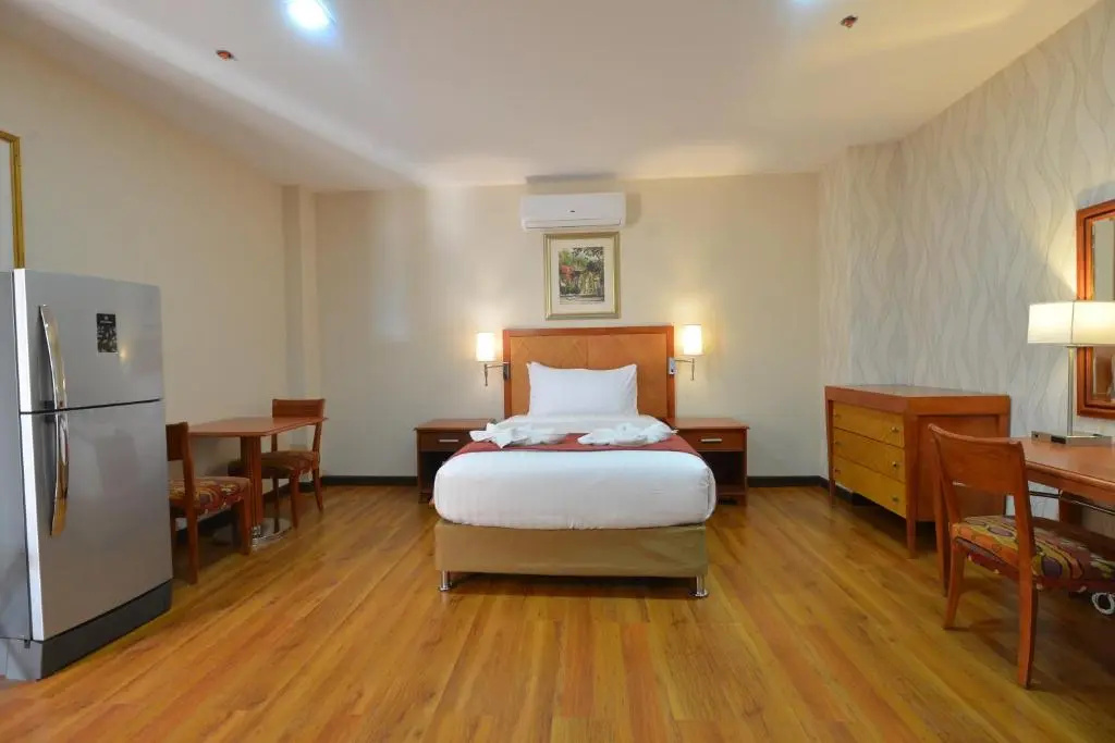 Royal Suites Condotel - Chambres