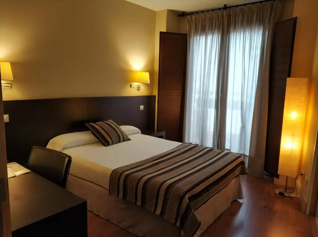 Hotel Puerta Del Arco - Chambres