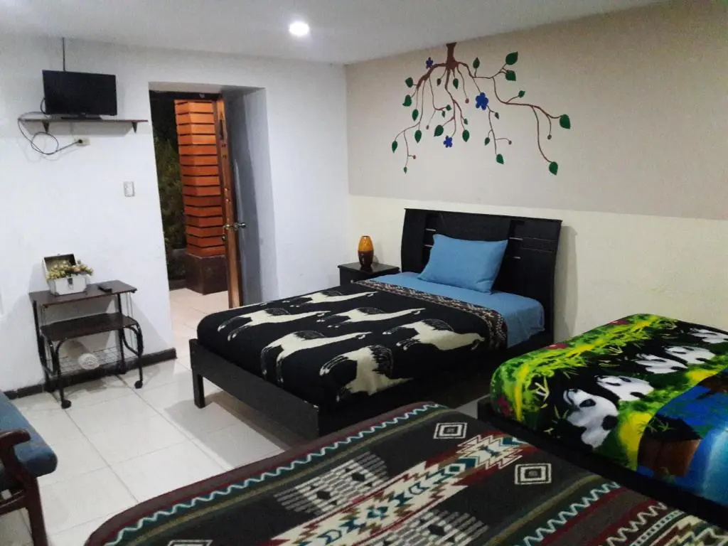 Standard Quadruple room with garden view