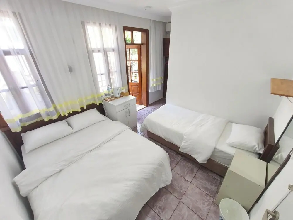 Classic Triple room with balcony and with garden view