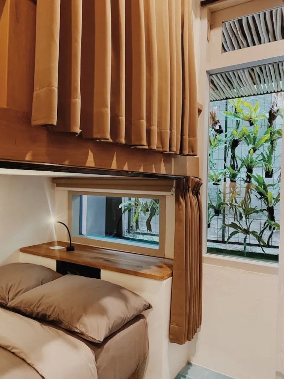 Bed in Dorm with courtyard view