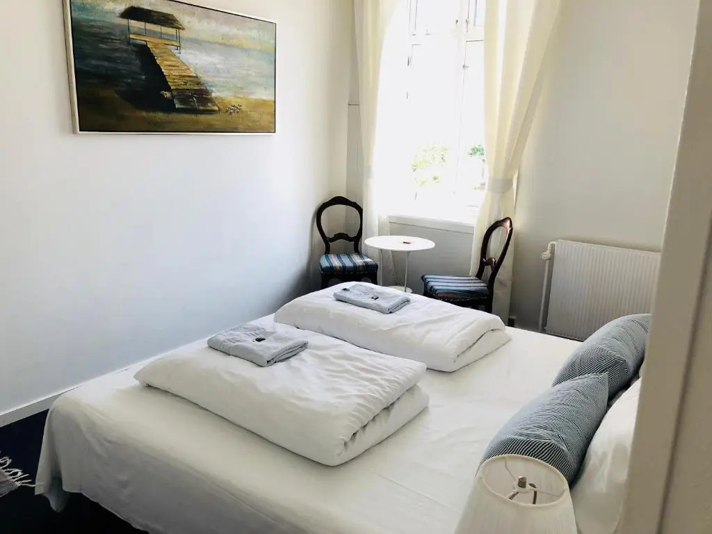 Standard Quadruple room with partial sea view