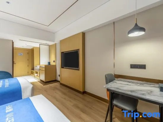 Xinyue Hotel - Chambres