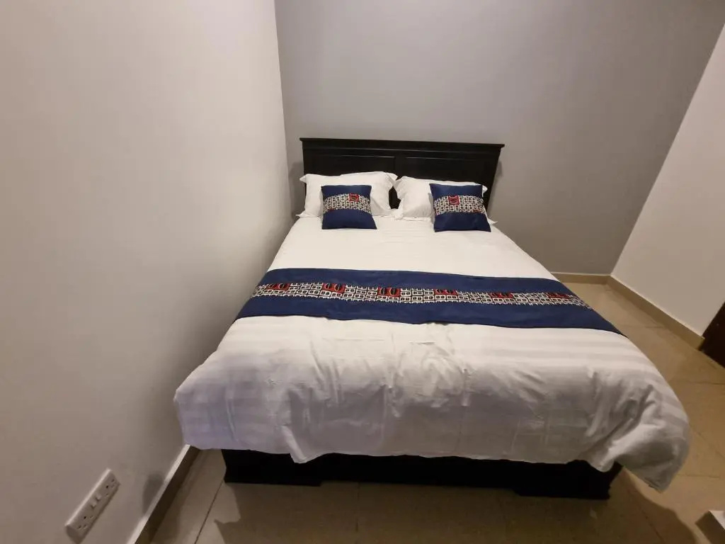Kampala Suites - Chambres