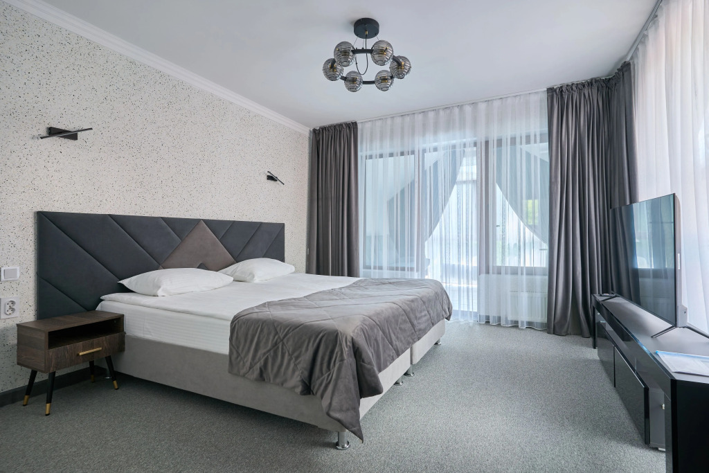 Двухместный номер Comfort с 2 комнатами с видом на реку двуспальная кровать в Белла