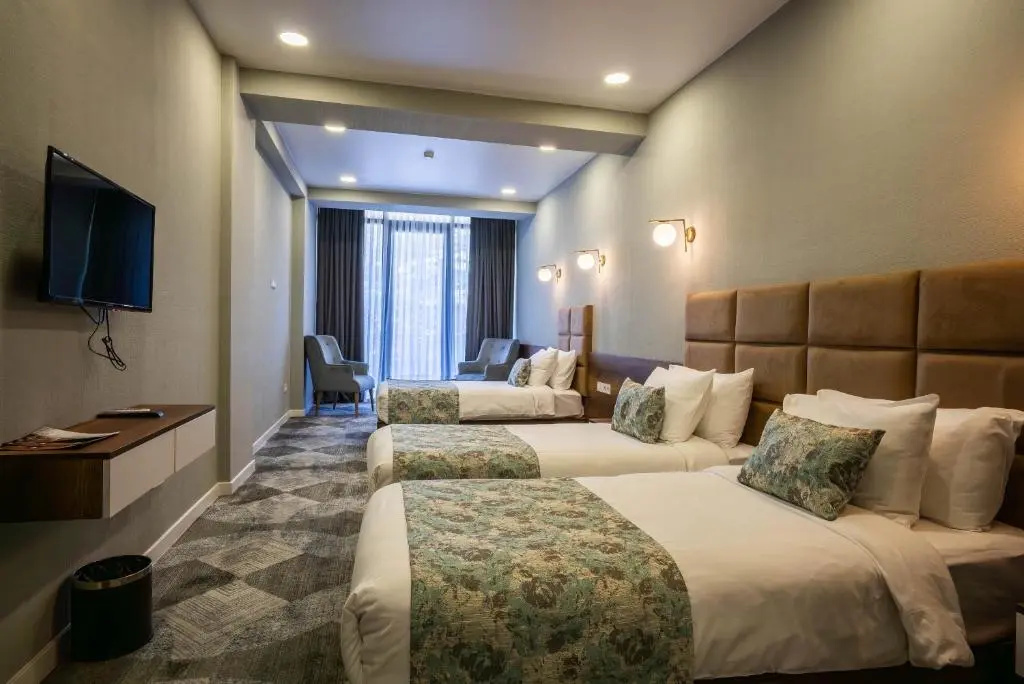 Standard Triple room with balcony and with garden view