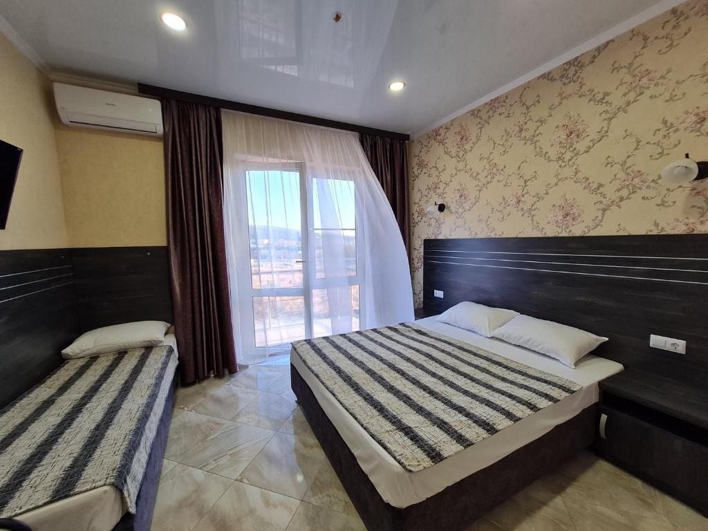 Двухместный номер Standard с балконом и с видом на море двуспальная кровать в Светлана