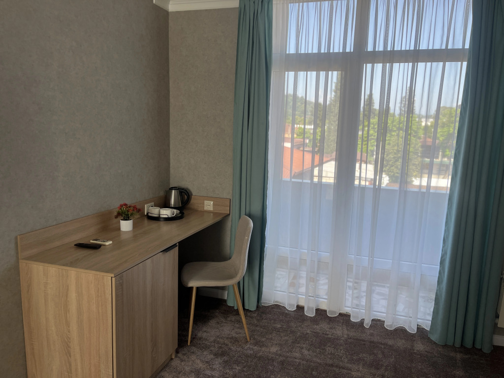 Четырёхместный номер Deluxe с балконом в Отель Столица
