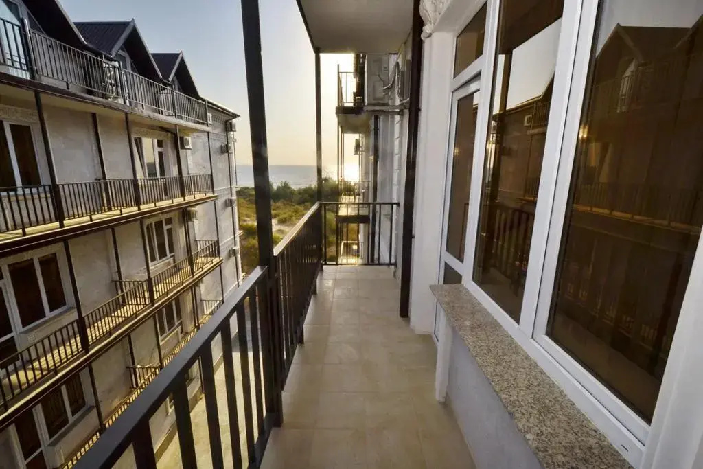 Comfort Quadruple room with balcony and with partial sea view