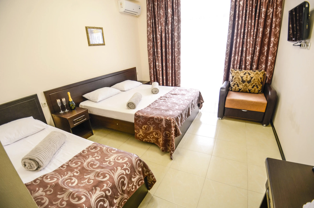 Deluxe Quadruple room with balcony and with sea view