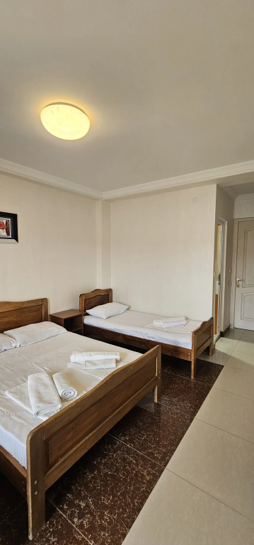 Standard Triple room with balcony and with courtyard view