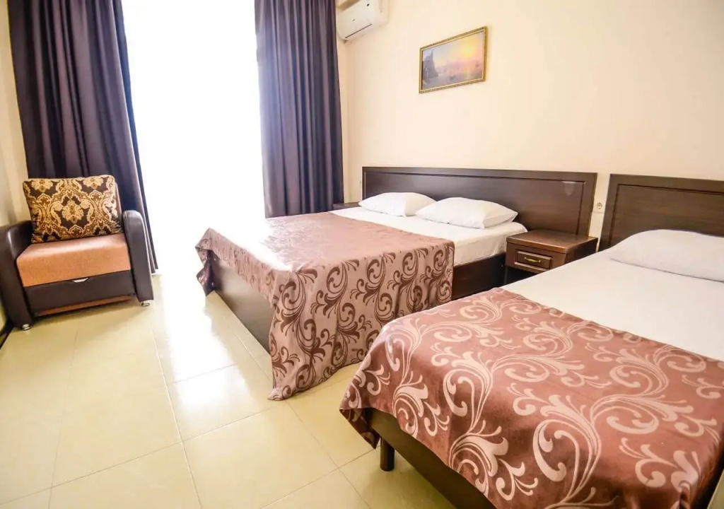 Deluxe Quadruple room with balcony