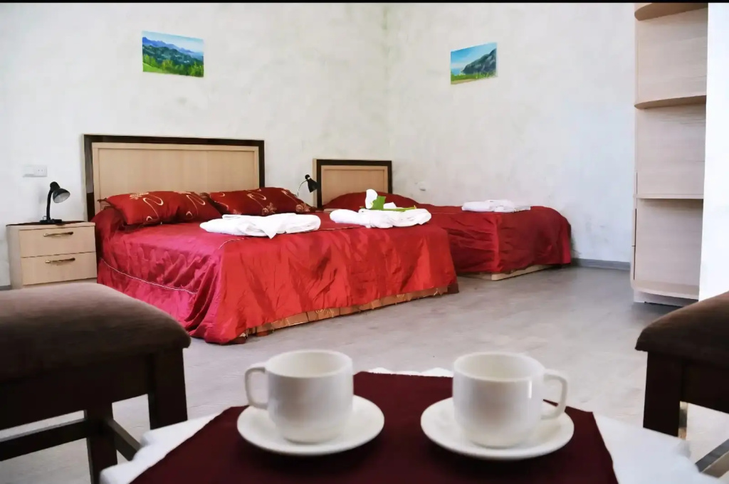 Deluxe Triple Family room with balcony and with mountain view