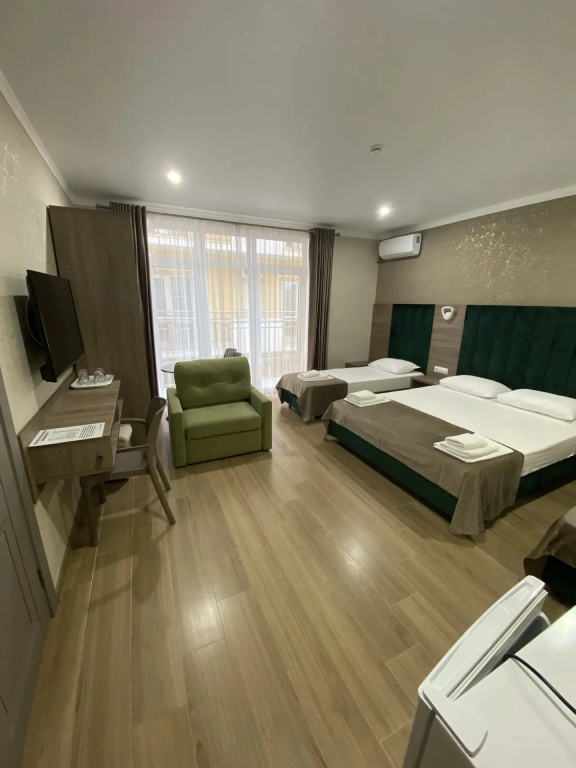 Deluxe Triple Family room with balcony and with courtyard view