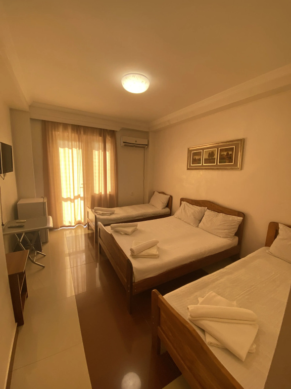 Standard Quadruple Family room with balcony and with courtyard view
