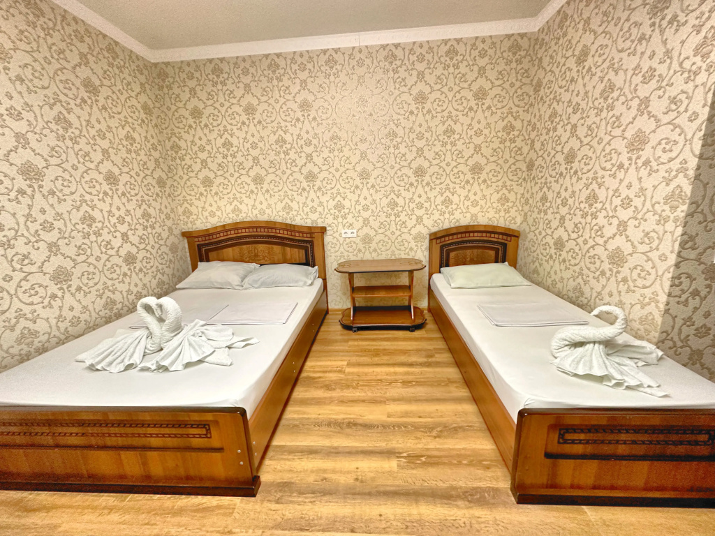 Triple room with balcony and beachfront