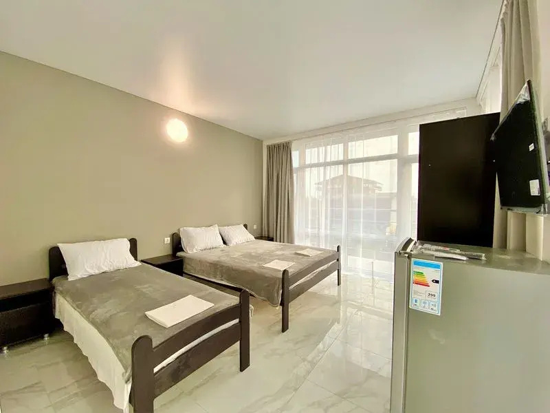 Comfort room with balcony and with city view