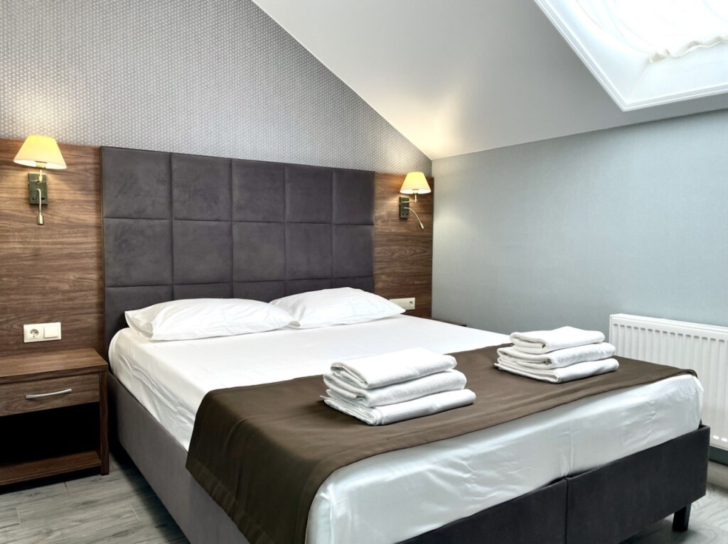 Четырёхместные апартаменты Superior с 2 комнатами с балконом и с красивым видом из окна в La Vida