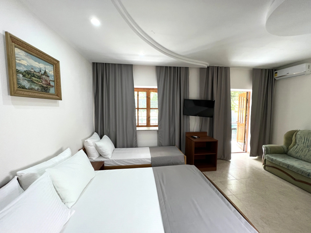 Deluxe Triple Family room with balcony