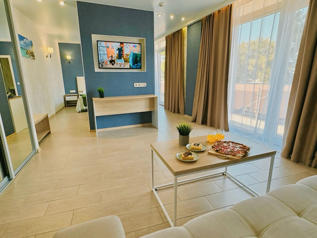 Superior Quadruple room with balcony and beachfront