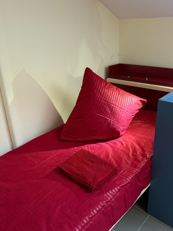Bed in Dorm with courtyard view