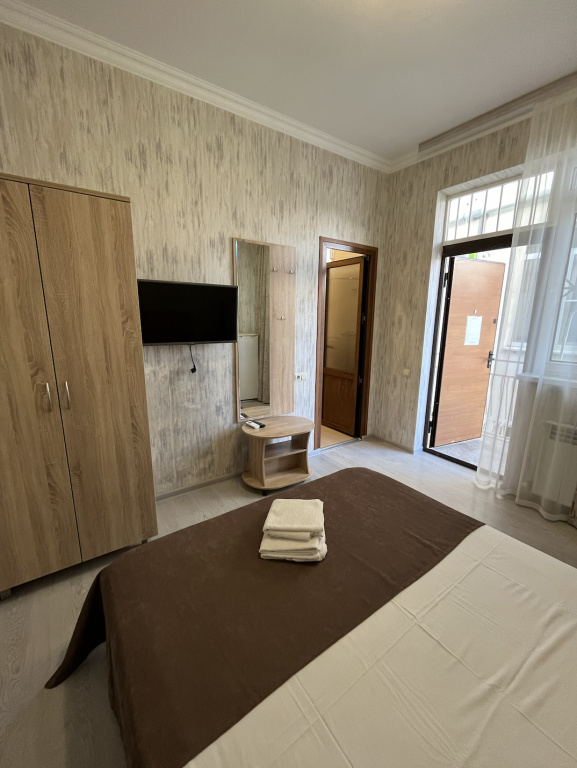 Comfort room with balcony and with courtyard view
