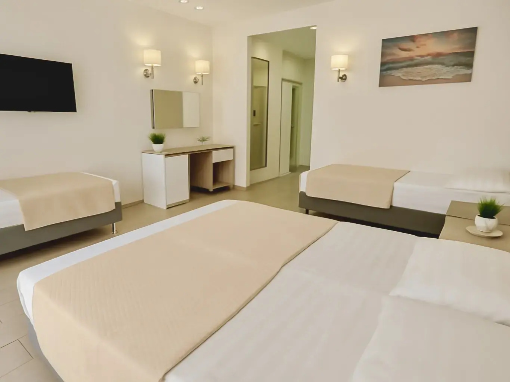 Comfort Quadruple room with balcony and beachfront