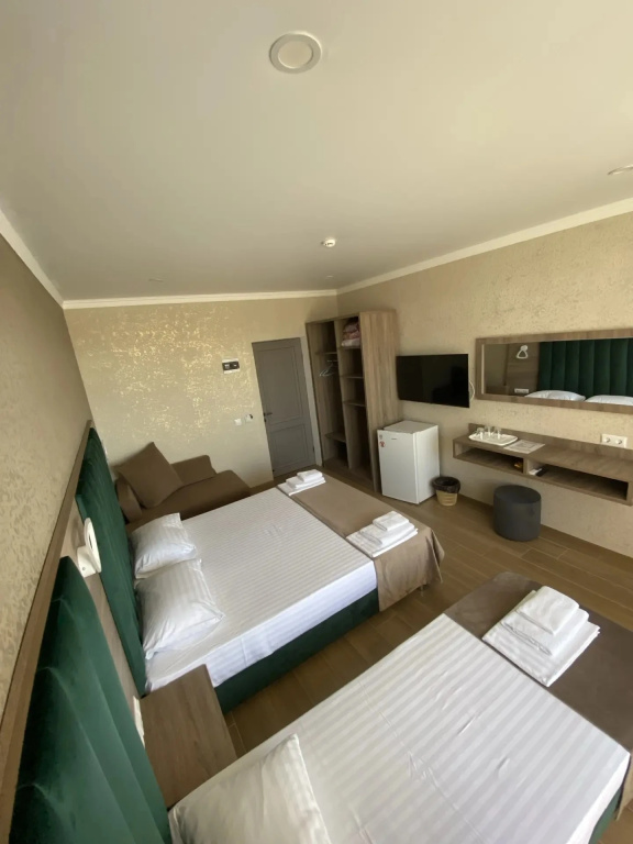 Deluxe Triple room with balcony and with courtyard view