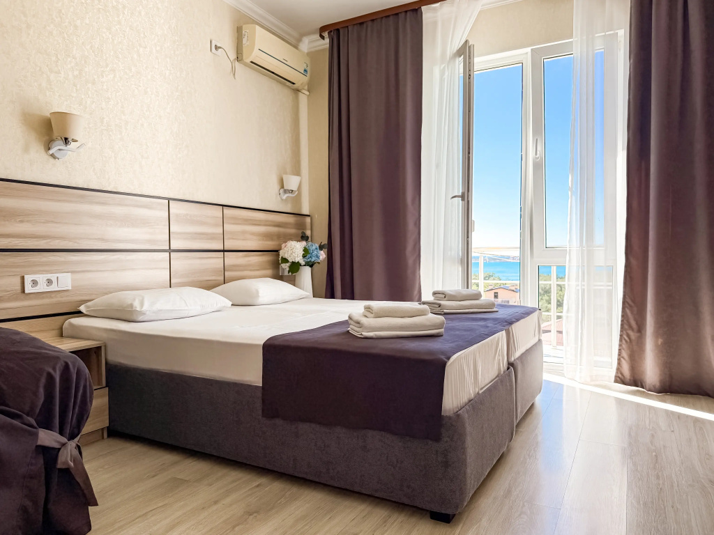 Superior Triple room with balcony and with sea view