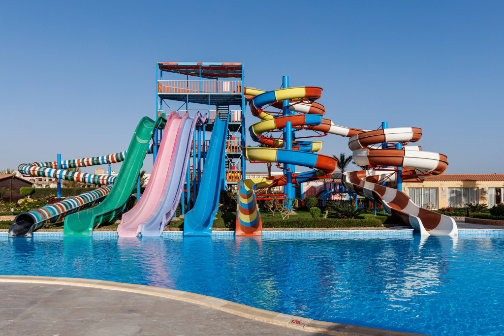Solara Aqua Park Resort by SUNRISE: Cool off in the outdoor pool beneath a colorful collection of water slides.