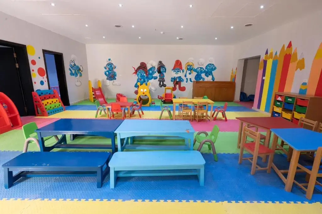 Parrotel Lagoon Waterpark Resort: A bright indoor children's playroom with colorful play equipment, child-sized tables and chairs, and soft floor mats.