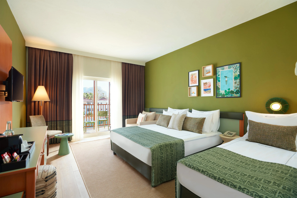 Comfort room with balcony and with garden view