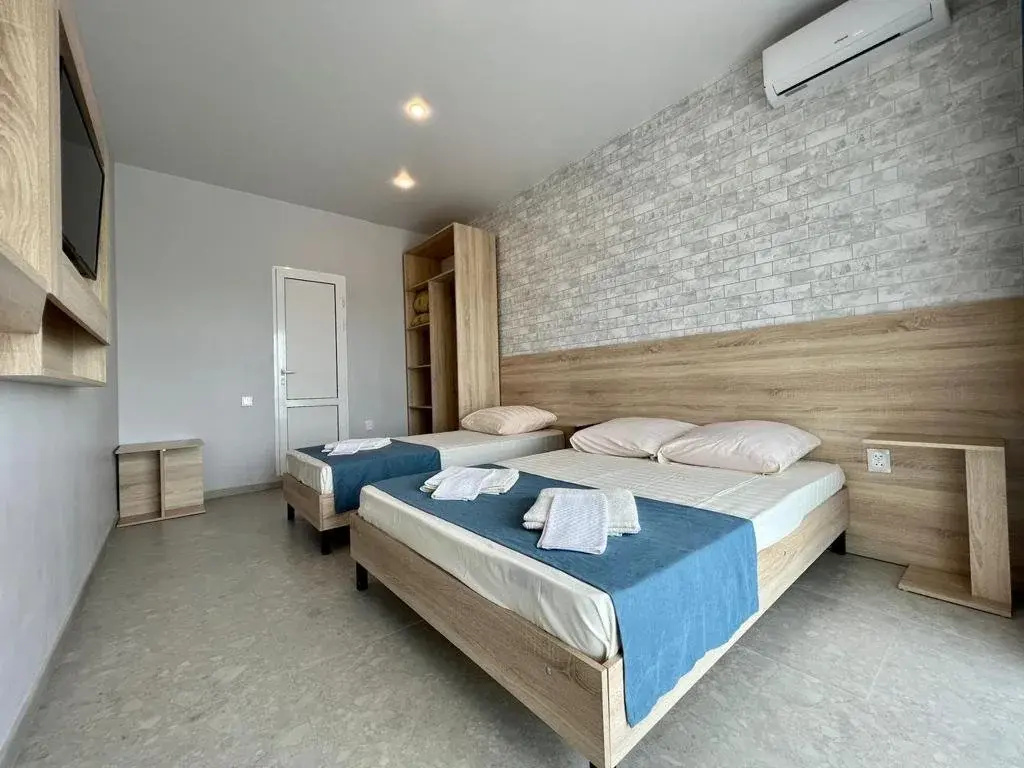 Standard Triple room with balcony and with courtyard view