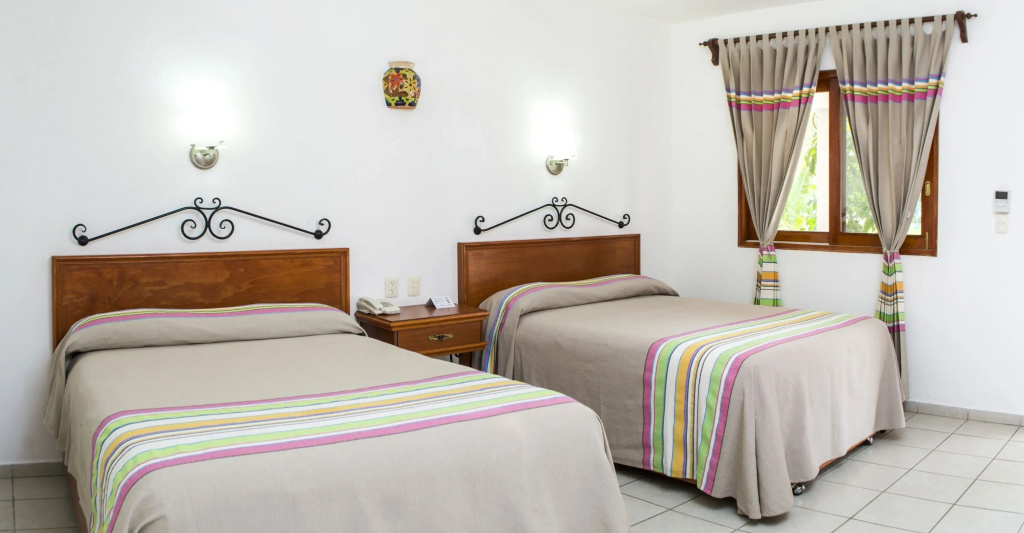 Standard Quadruple room with garden view