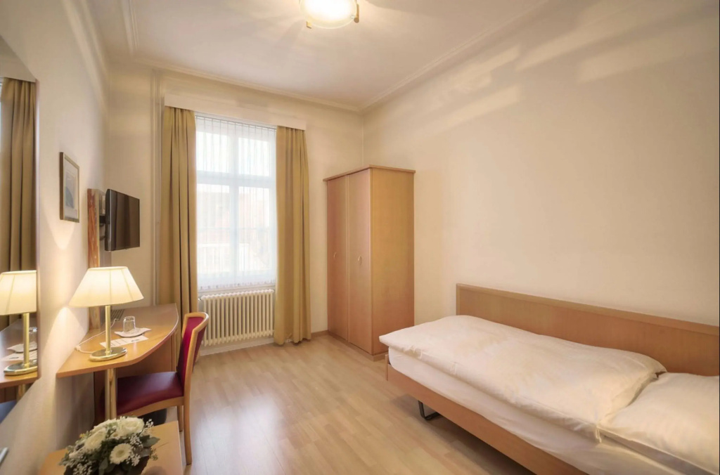 Central City Hotel Rochat - Chambres