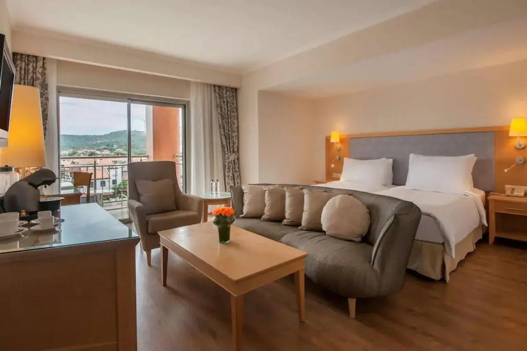 Double Junior Suite with balcony and with pool view (full double bed)