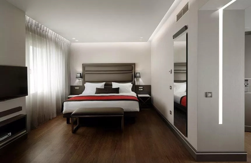 Holiday Suites - Chambres