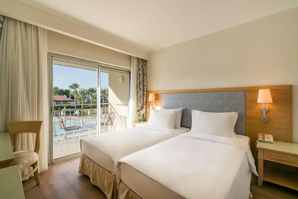 Superior Quadruple Suite with balcony and with pool view