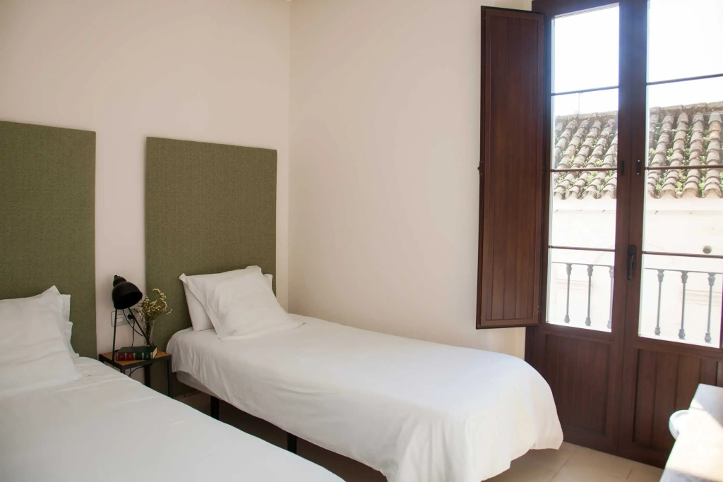 Guzman El Bueno Suites - Chambres
